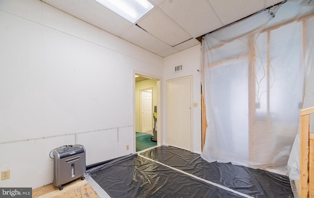 bedroom featuring a drop ceiling