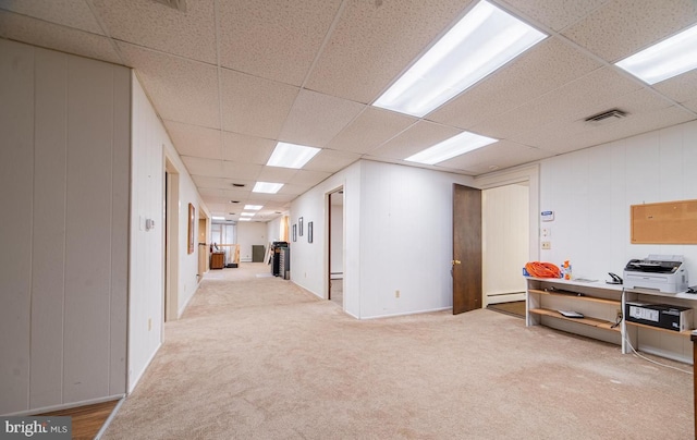 basement with carpet floors and baseboard heating