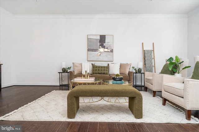 sitting room with wood-type flooring and ornamental molding