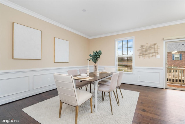 dining room featuring crown molding and dark wood-type flooring