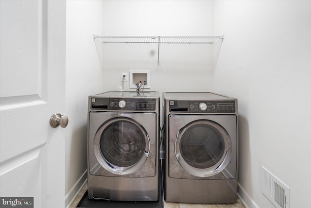 laundry room featuring independent washer and dryer