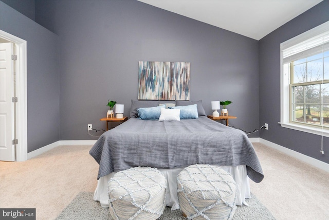 carpeted bedroom featuring vaulted ceiling