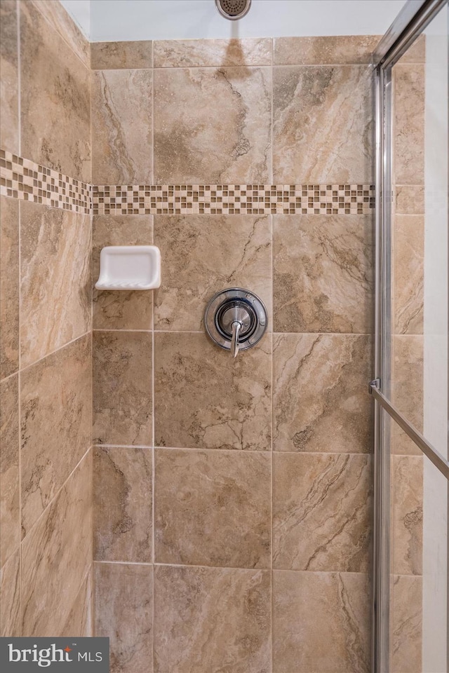 bathroom with tiled shower