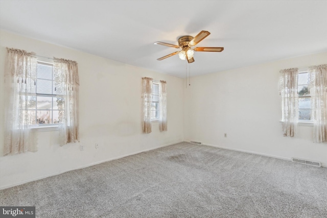 carpeted empty room with ceiling fan