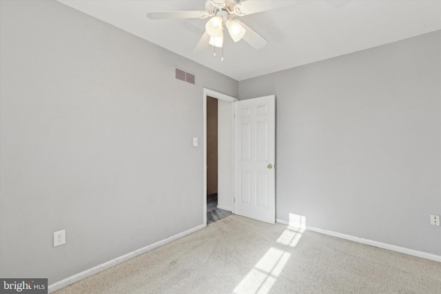 empty room with light carpet and ceiling fan