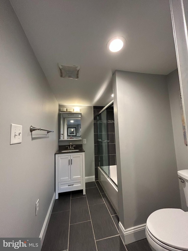 full bathroom with toilet, vanity, and combined bath / shower with glass door