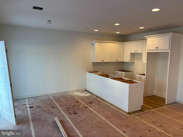 kitchen featuring white cabinets