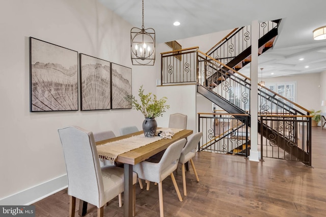 dining room featuring hardwood / wood-style flooring and a notable chandelier