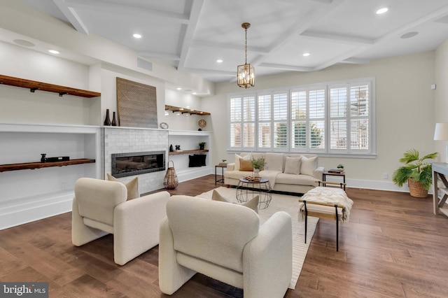 living room featuring built in shelves, coffered ceiling, beam ceiling, and dark wood-type flooring