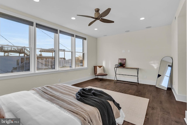 bedroom featuring dark wood-type flooring and ceiling fan