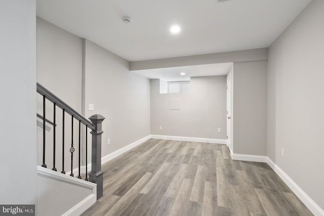 basement featuring light wood-type flooring