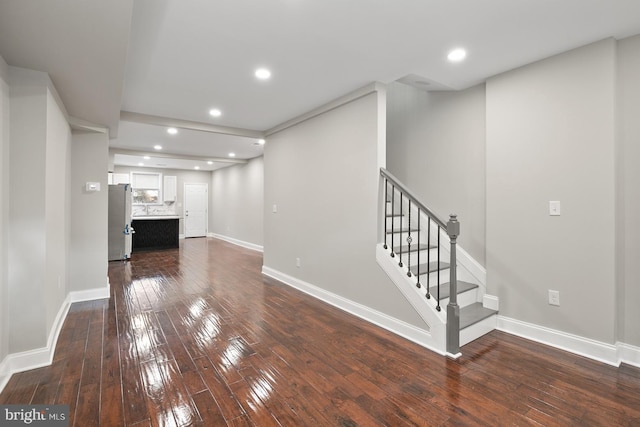 unfurnished living room featuring hardwood / wood-style flooring