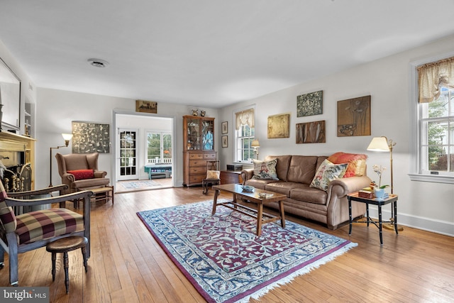 living room featuring hardwood / wood-style floors and a fireplace