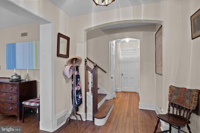 corridor with wood-type flooring