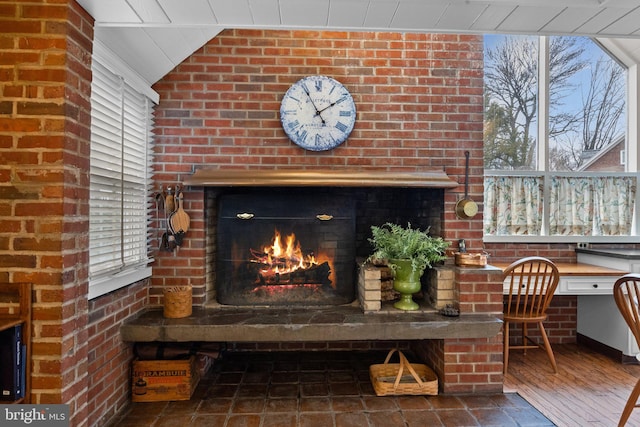 details featuring a brick fireplace and built in desk