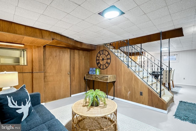 interior space with concrete floors and wood walls