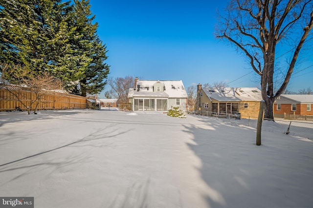 rear view of house with a sunroom