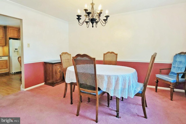 dining room with light colored carpet, crown molding, and a notable chandelier