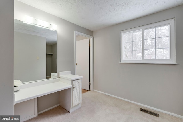 bathroom with a textured ceiling