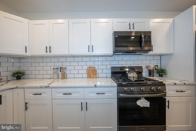 kitchen featuring white cabinetry and stainless steel appliances