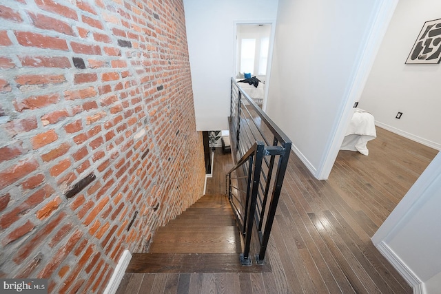 staircase featuring hardwood / wood-style flooring