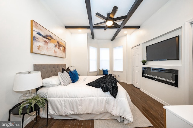 bedroom with beamed ceiling, dark hardwood / wood-style flooring, and ceiling fan