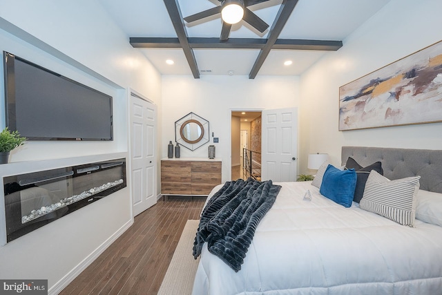 bedroom featuring beamed ceiling, dark hardwood / wood-style floors, ceiling fan, and coffered ceiling