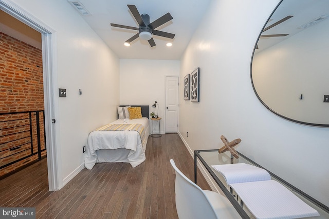 bedroom with ceiling fan and dark wood-type flooring