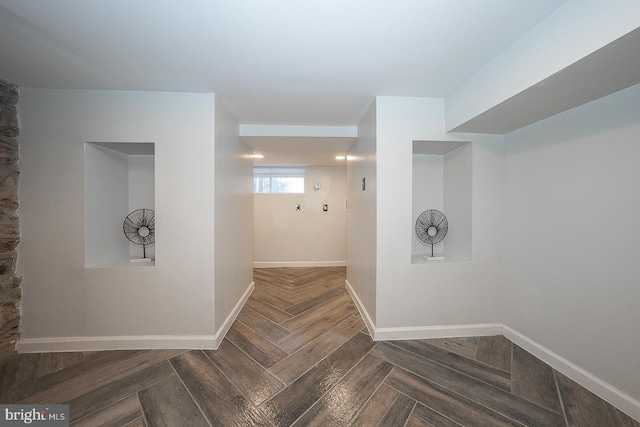 interior space featuring dark parquet flooring