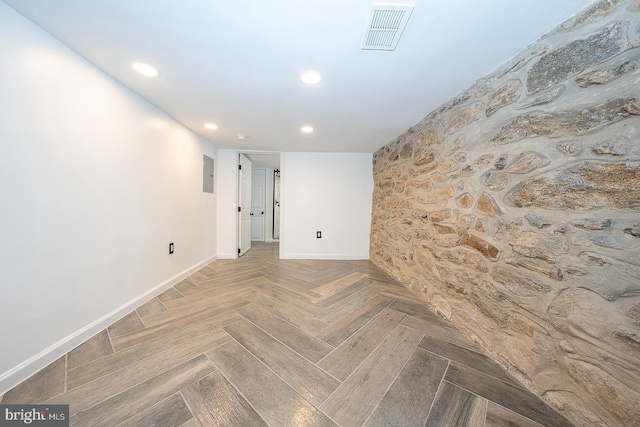 spare room featuring parquet flooring