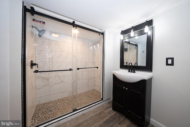 bathroom with vanity and a shower with shower door