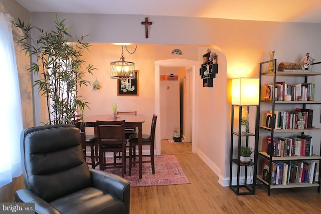 dining room featuring light hardwood / wood-style flooring and an inviting chandelier