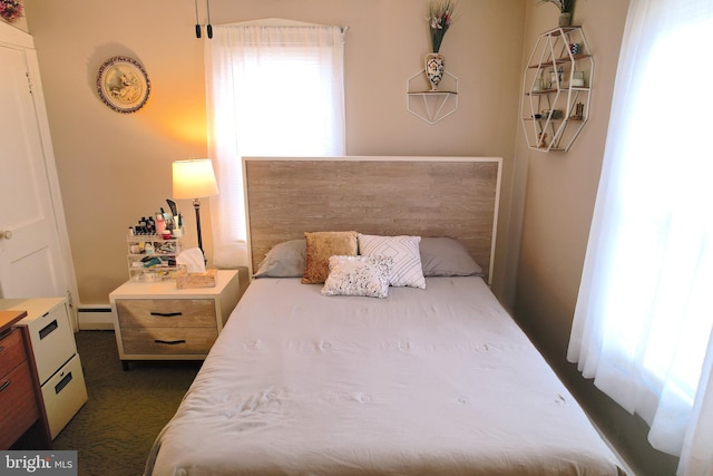 bedroom featuring a baseboard heating unit