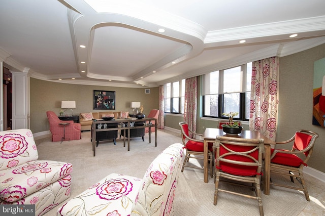 dining space with light carpet and ornamental molding