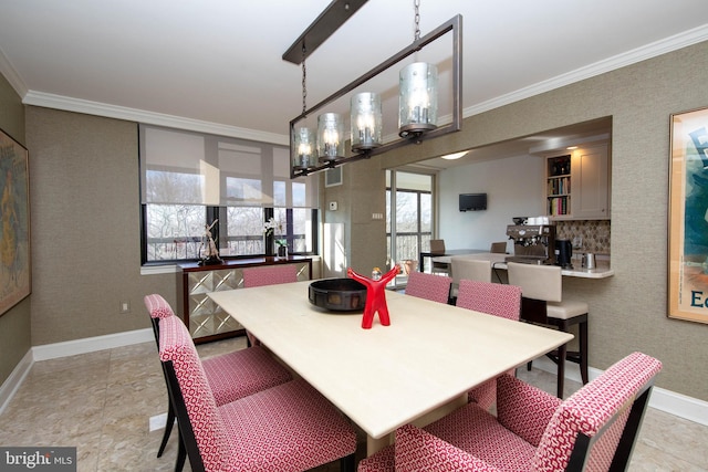 dining room featuring an inviting chandelier and ornamental molding