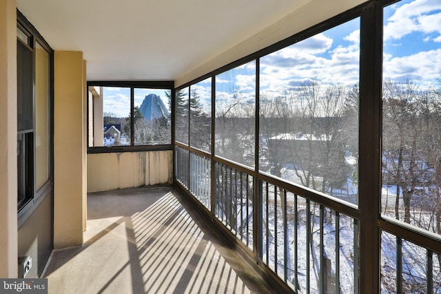 unfurnished sunroom featuring a healthy amount of sunlight