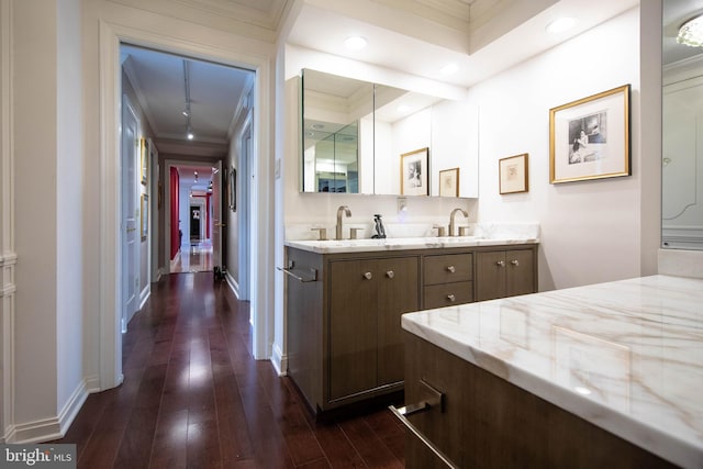 bathroom with vanity, ornamental molding, and hardwood / wood-style flooring