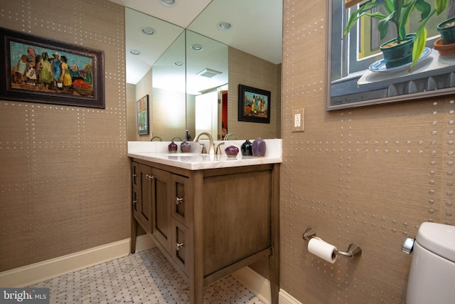 bathroom featuring vanity and toilet