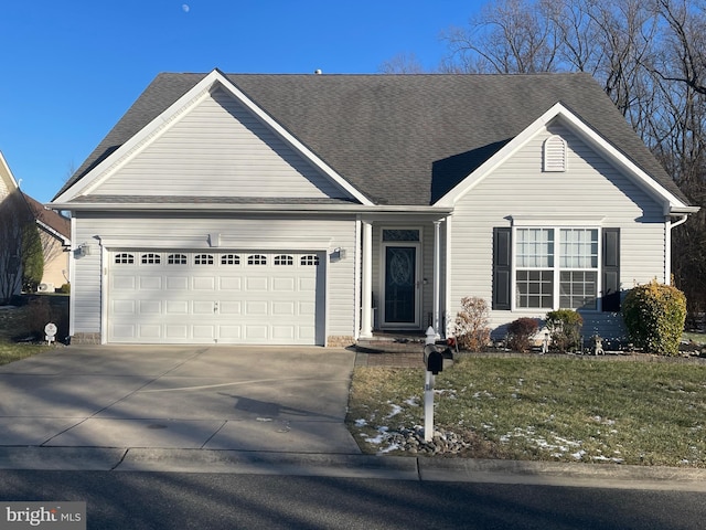 single story home with a front yard and a garage