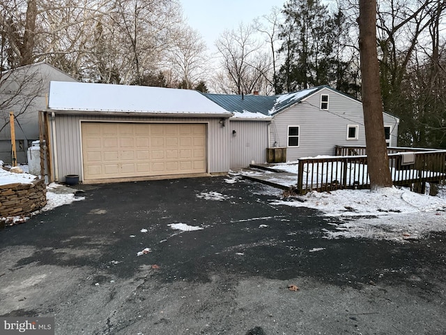 view of front of property with a garage and a deck