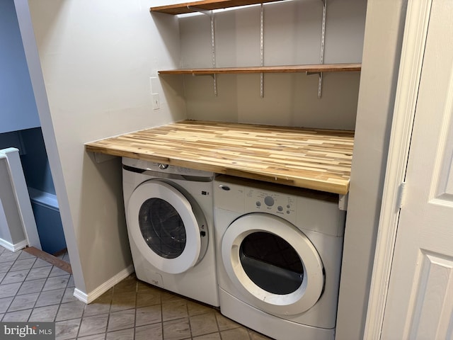 laundry room featuring washing machine and clothes dryer