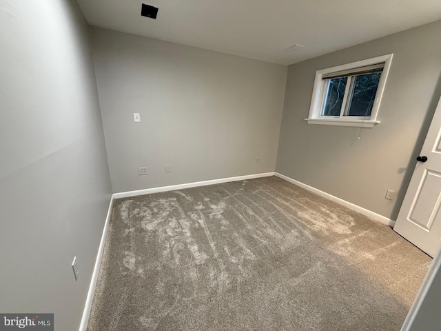 unfurnished room with carpet flooring