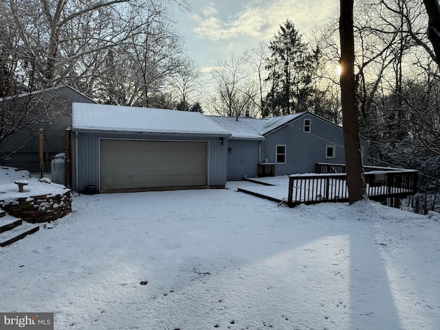 view of front of home featuring a deck and a garage