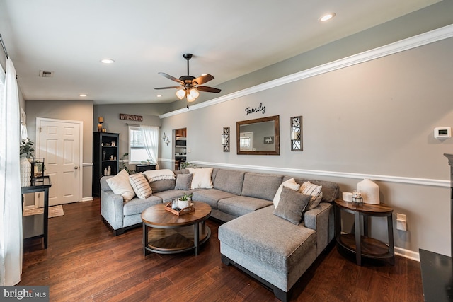 living room with dark hardwood / wood-style flooring, vaulted ceiling, and ceiling fan