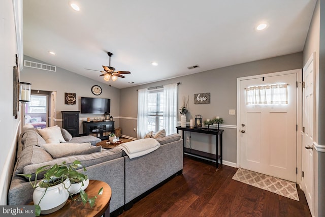 living room featuring dark hardwood / wood-style floors, ceiling fan, and lofted ceiling