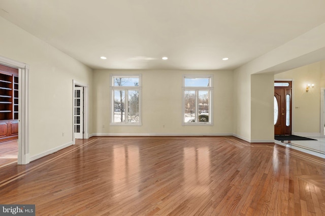 unfurnished living room featuring light hardwood / wood-style floors