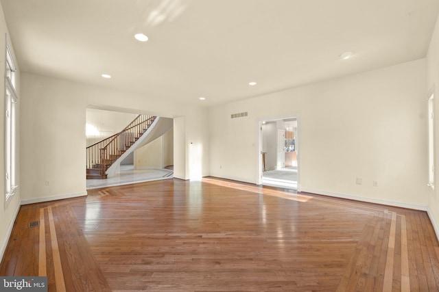 unfurnished living room featuring hardwood / wood-style floors