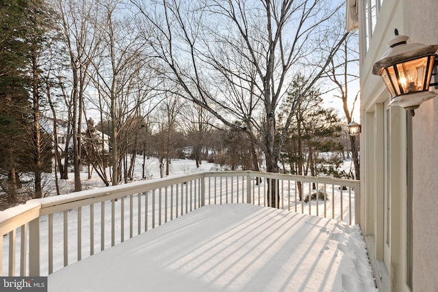 view of snow covered deck