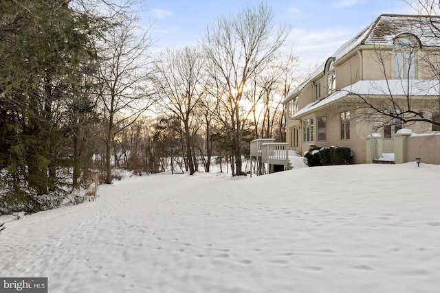 view of yard layered in snow