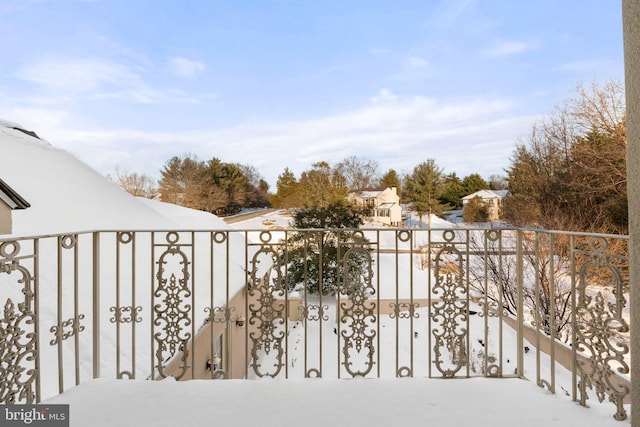 view of snow covered gate